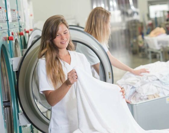 Girl Emptying Dryer After a Dryer vent cleaning in New York City