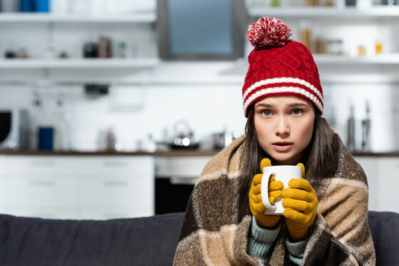 a woman trying to warm up that needs a Temporary Portable AC Rental in Brooklyn, NY